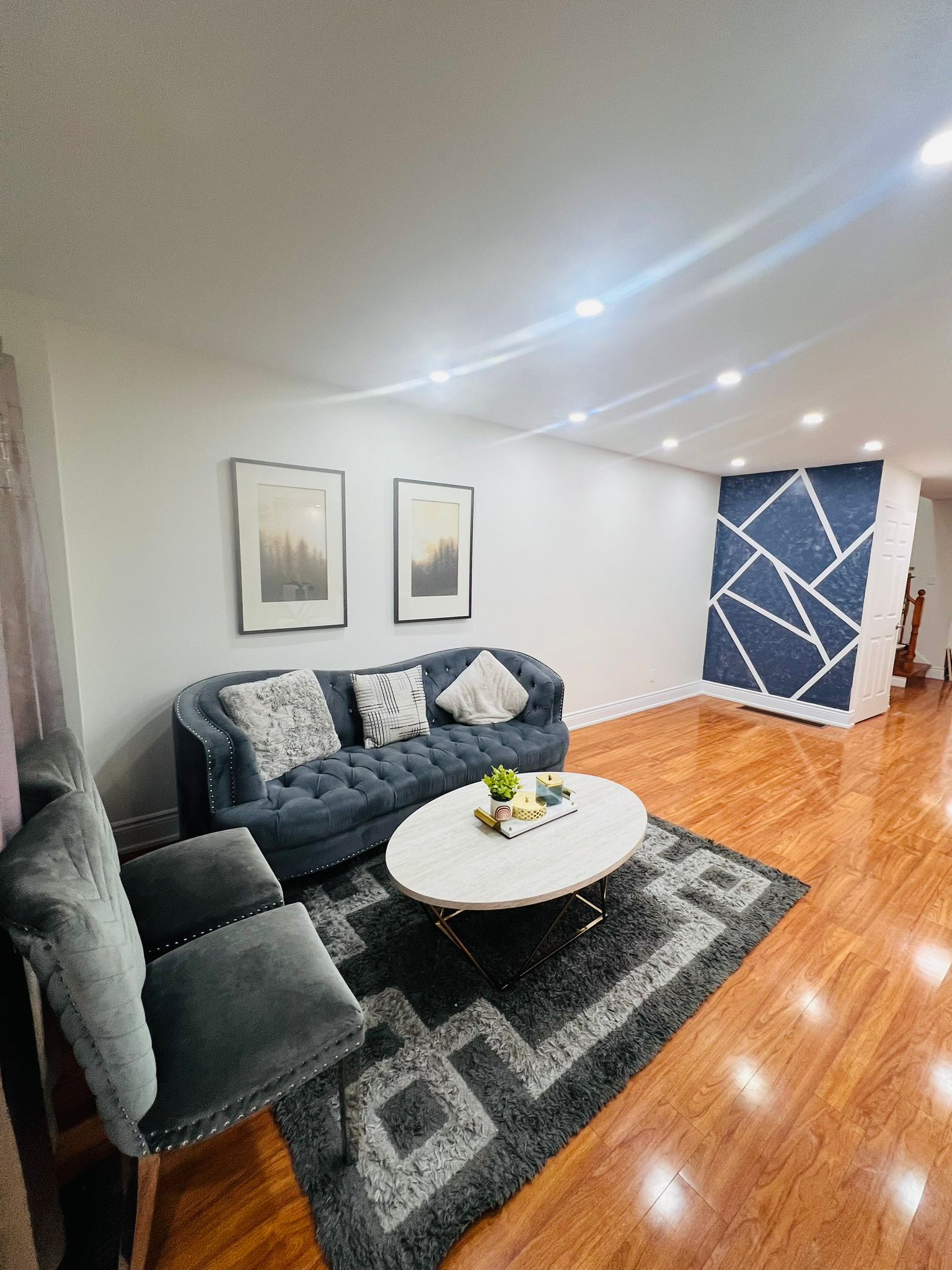 Open-concept living by Aim Baaaz Builders